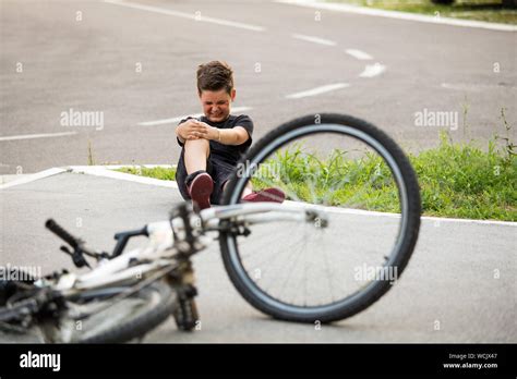 Kid Hurts His Leg After Falling Off His Bicycle Child Is Learning To