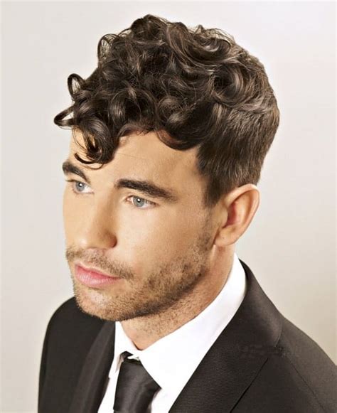 This haircut has small faded areas around the arches of the ears while the rest of the hair is long and shaggy and feathered using precision scissors to separate the strands. 1920s Hairstyles for Men - 15 Handsome Looks to Copy