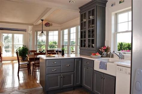 Make yours stand out with a few smart cabinetry upgrades. Gray kitchen cabinets with white appliances | Kitchen ...