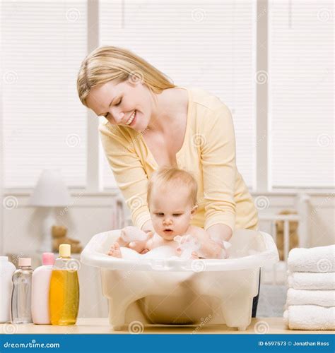 Mother Give Baby Girl A Bath Royalty Free Stock Photo Cartoondealer