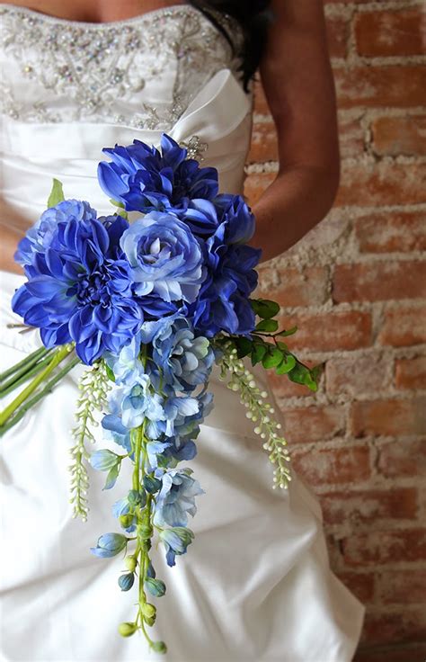 Royal blue trimmed 4 tier round and square wedding cake. Blue Delphinium Bouquet Flowers|http://refreshrose ...