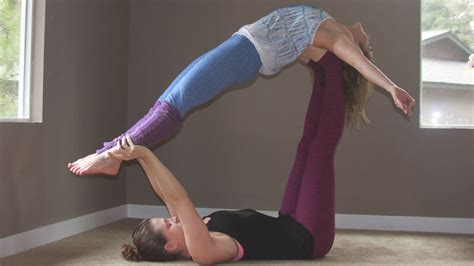 This easy yoga pose for two stretches the hamstrings. Beginners Guide to Acro Yoga - Rachael Flatt