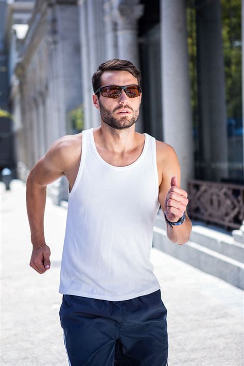 Handsome Athlete With Sunglasses Jogging In The City Sunglasses And Style Blog