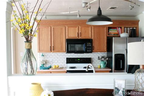 This adds a rustic quality, and works particularly well with a dark granite. Great Ideas to update Oak Kitchen Cabinets