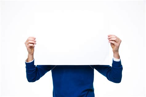 Man Holding A Blank Paper Over White Background Royalty Free Stock Image Storyblocks