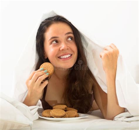 Woman Eating Cookies In Bed Stock Photo Image Of Chocolate