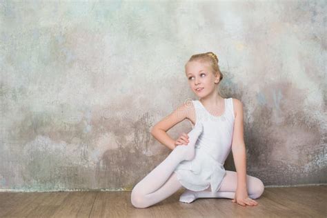 Little Ballet Dancer Doing Stretching Before Exercise Stock Image