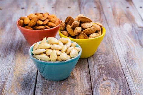 Premium Photo Assortment Of Almond Nuts Peeled And Fried Unpeeled