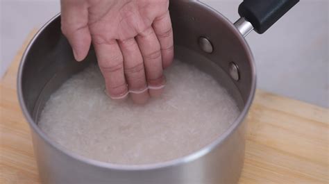 Bring to simmer on medium high without the lid; How Much Water To Add To The Rice Cooker? - The Whole Portion
