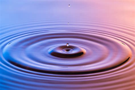 What does ripples expression mean? Water Drop Close Up With Concentric Ripples On Colourful ...