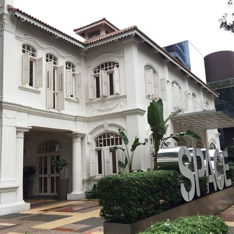 A Large White Building With Lots Of Windows