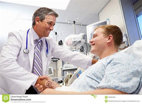 Young Male Patient Talking To Doctor In Emergency Room Stock Image
