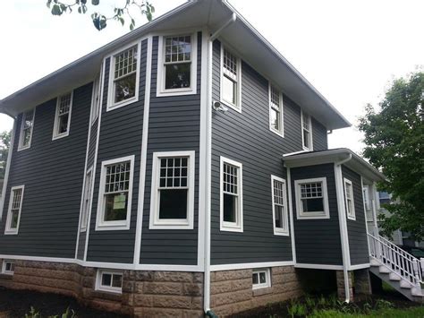 White shiplap provides a clean interior look of a nickel gap wall panel. James Hardie Chicago Siding by A.B. Edward Enterprises ...