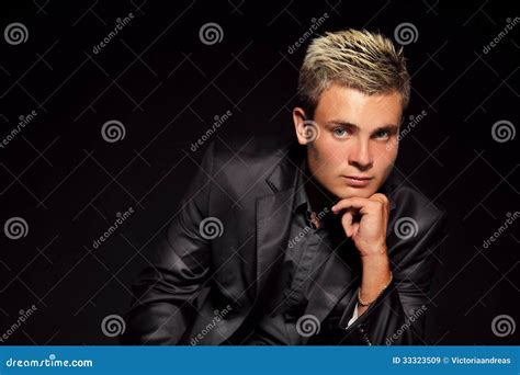 Elegant Young Handsome Man Over Dark Studio Fashion Portrait Stock
