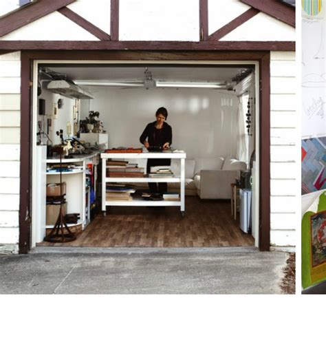 A Man Sitting At A Desk In The Back Of A Garage With An Open Door