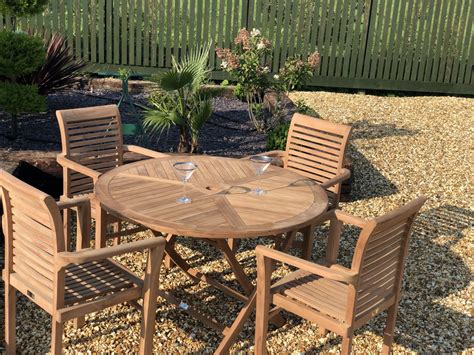 It is a fabulous table, somehow it seems perfect for four but at a squeeze you can fit ten people round it. Teak Garden Furniture Round Folding Table 4 Stacking ...