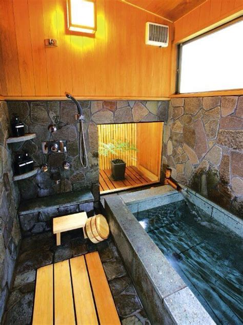 An Indoor Hot Tub With Wooden Benches And Windows