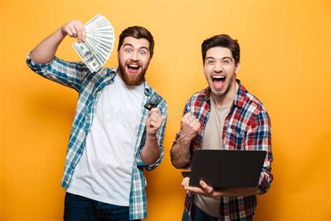 2348 Two Happy Young Men Holding Laptop Stock Photos Free And Royalty