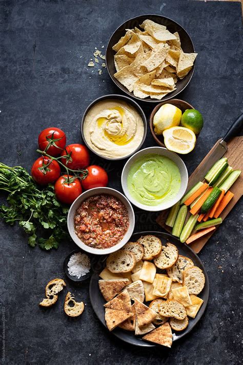 ASSORTED APPETIZER PLATTER WITH THREE DIPS By Stocksy Contributor