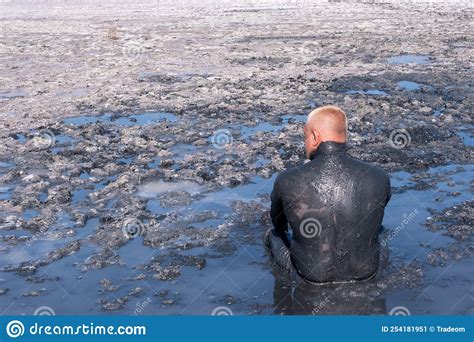 A Man Applies Healing Mud To His Body Beneficial Effect On The Body