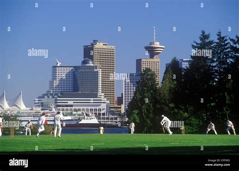 Players Enjoy A Game Of Cricket In Stanley Park Vancouver British