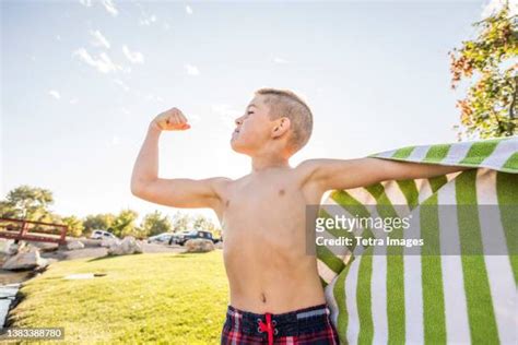 Boy Flexing Muscle Photos And Premium High Res Pictures Getty Images