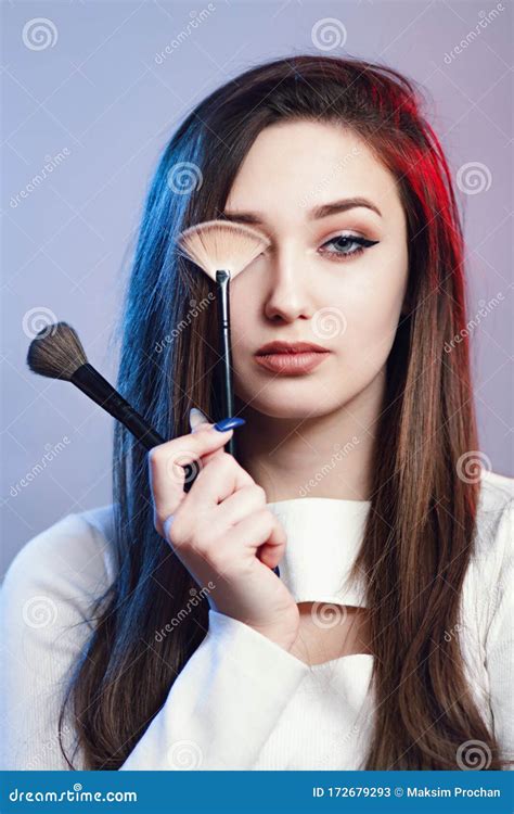 Portrait Of Confident Girl Brushes In Hand Face Of Young Woman With
