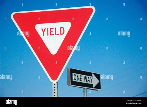Yield And One Way Signs On Freeway Highway For Drivers To See At
