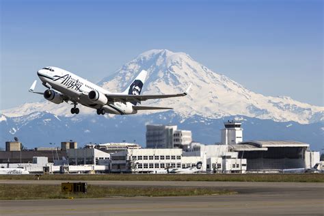 Alaska Airlines 737 taking off from Sea-Tac Airport with Mt Rainier and