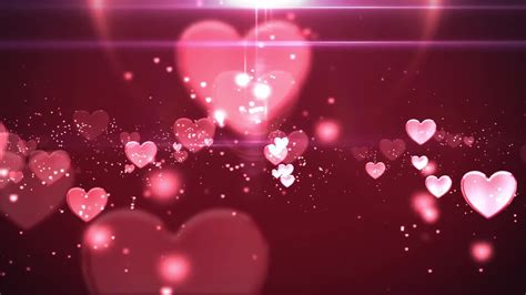 Pink Blinking Hearts Fading And Sparkling In A Dark Pink Background