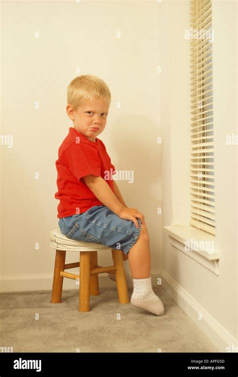 Three Year Old Sitting On Stool For Time Out Stock Photo Alamy