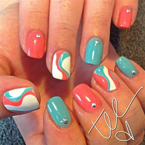 Choose a teal color with green hues and create a simple white design on your middle finger. summer nails (I couldnt decide whether the coral or the ...
