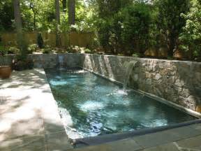 Lap Pool With Sheer Descent Waterfalls And Retaining Walls
