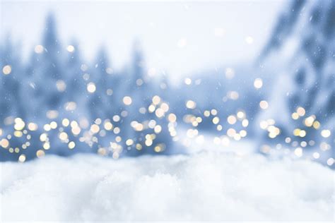 Snowy Winter Christmas Bokeh Background With Circular Lights And Trees