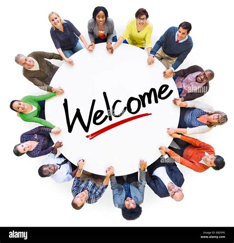 Group Of People Holding Hands Around The Word Welcome Stock Photo Alamy