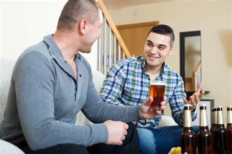 Premium Photo Two Men Drinking Beer