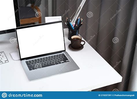 Laptop With Blank Screen On White Desk In Home Office Stock Image