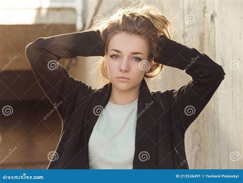 Blonde Girl Posing Holding Her Hands Behind Her Head Close Up Stock Image Image Of Blonde