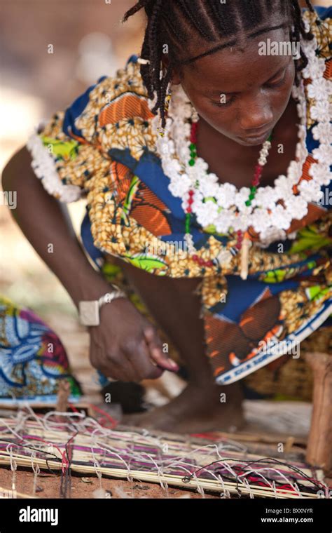 In The Town Of Djibo In Northern Burkina Faso A Fulani Woman Weaves A