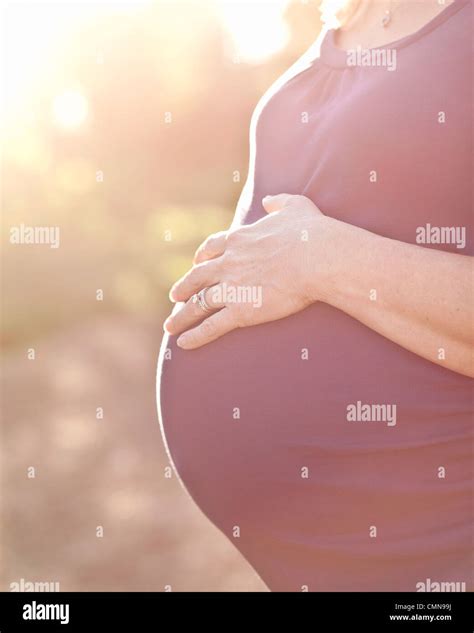 Pregnant Caucasian Woman Caressing Stomach Stock Photo Alamy