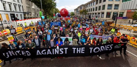 tens of thousands rally against the tories as party conference kicks off in manchester morning