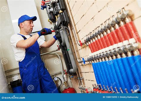 Plumber Work Installing Collector For Warm Water Underfloor Heating