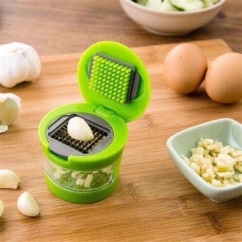 Mini Garlic Press With Stainless Steel Blades And Inbuilt Clear Plastic