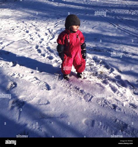 Toddler Walking In Snow Stock Photo Alamy