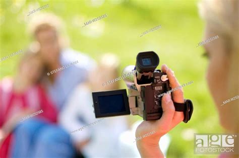 Grandmother With Little Girls Digital Videocamera Stock Photo