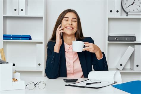 Premium Photo Woman In The Office Is Drinking Coffee