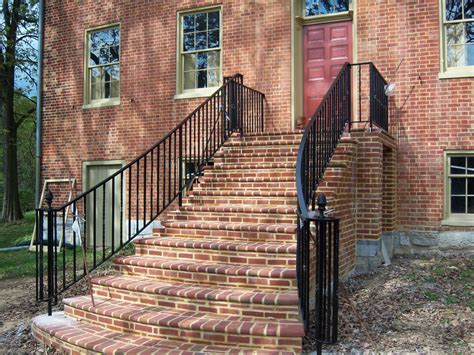 Iron exterior railings offer beauty and security for pedestrians as they traverse terraces, walkways and stairs. Curved Railings Make All The Difference. - Antietam Iron Works