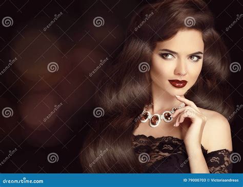 Elegant Brunette Woman With Long Shiny Wavy Hair Beauty Makeup Stock