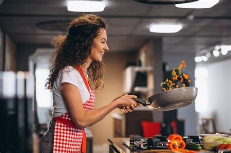 Woman Chef Cooking Vegetables In Pan Free Photo