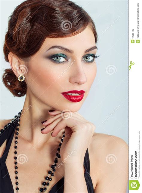 Beautiful Young Woman With Evening Makeup And Hair With